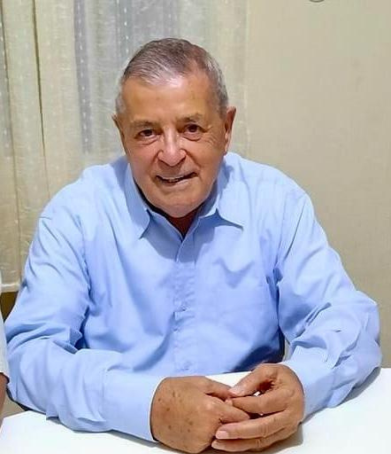 Father Joseph Camilleri dressed up in a collared shirt.